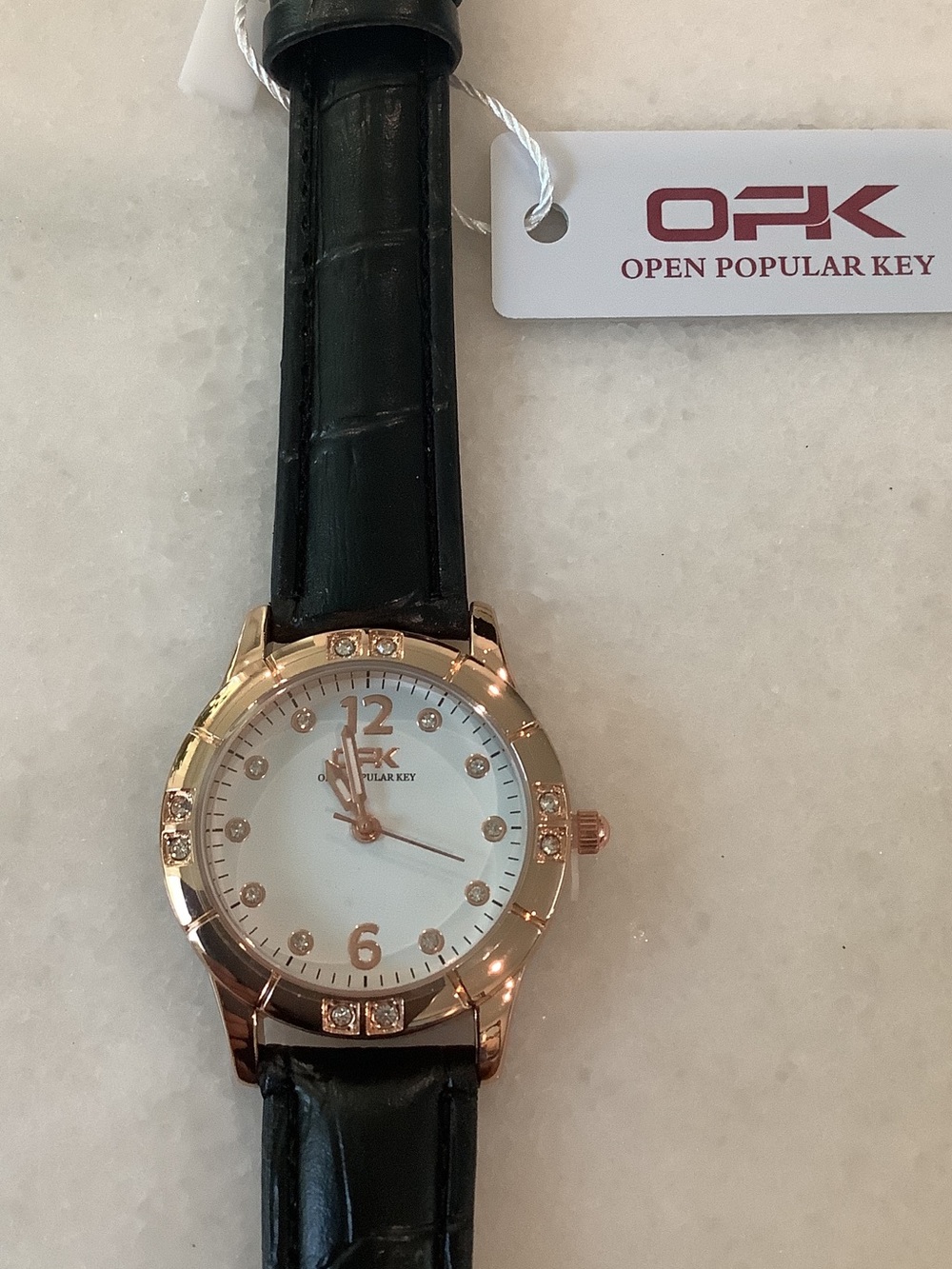 OPK Women’s Rose Gold Tone Watch with White Dial, Black Leather Strap, Brand New